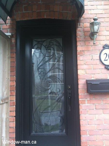 Single steel insulated front door. Black color. Full glass Port Union wrought iron glass insert